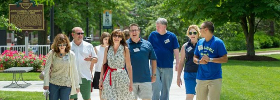 Group of  alumni walking on campus